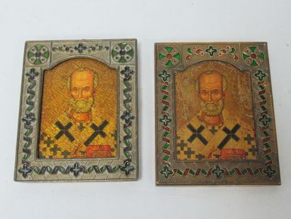 null Set of two enamelled metal frames containing wood reproductions of saints. 10...