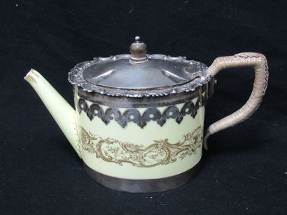 null Yellow porcelain teapot with gold highlights (crack underneath). English silver...