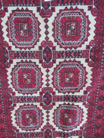 null AFGHANISTAN Ancien tapis Belloch, à décor géométrique sur fond rouge. 168 x...