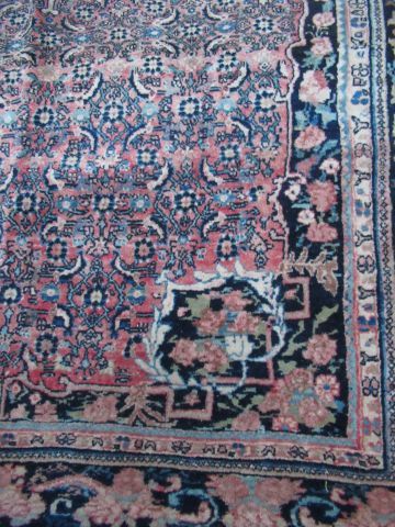 null IRAN Ancien tapis Sarouk en laine, à décor végétal sur fond rose. 260 x 165...