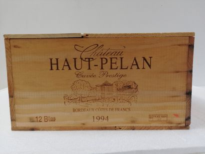 null 12 bouteilles de Château Haut Pélan. 1994. Cuvée prestige. Caisse bois d'or...