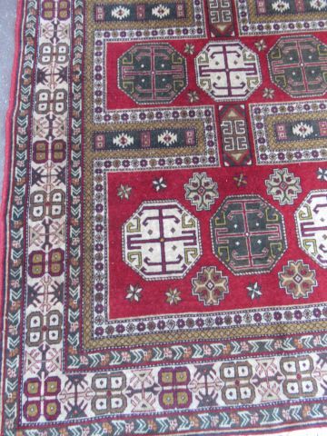 null CAUCASE Chirvan wool carpet with geometric decoration on burgundy background....