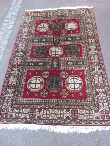  CAUCASE Chirvan wool carpet with geometric decoration on burgundy background. 215...