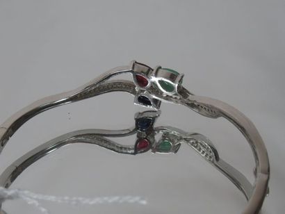 null Bracelet in silver (opening), set with emeralds, rubies, sapphires. Gross weight:...