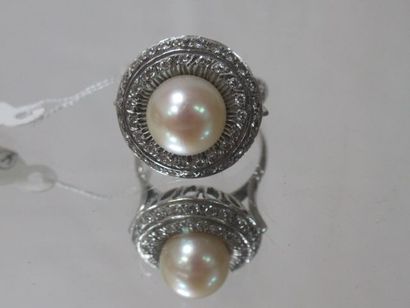 null 18K white gold coktail ring set with a cultured pearl and diamonds. French work....