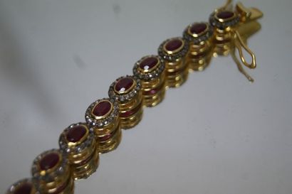 null A vermeil bracelet, set with rubies in a diamond setting. Gross weight: 36,05...