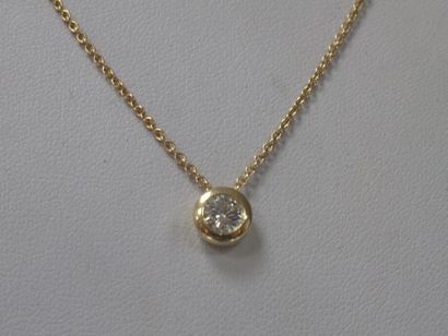 Set in 18K yellow gold comprising a chain...