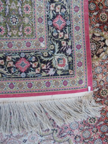null Ferahan carpet in wool and silk, with vegetal decoration on a pink background....