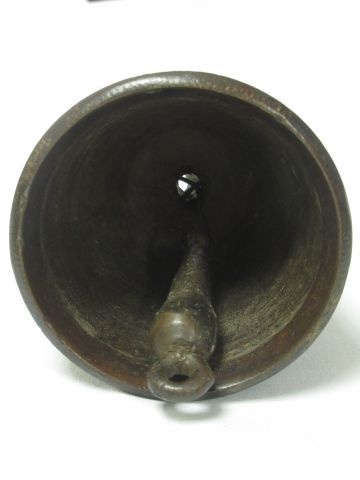 null Old bell in bronze. On its base in metal and wood. Height: 10 cm