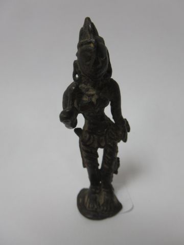 null Tribhanga deity standing, carrying a lotus stem in bud. South India, 14th-16th...