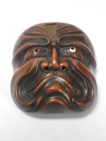 JAPON Nestuke en bois, en forme de Masque...