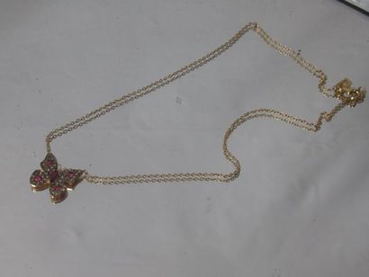 null Necklace in yellow gold 18 Kt decorated with a butterfly set with small rubies...