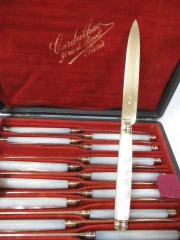 null Fruit set, including 24 knives with mother-of-pearl handles, 12 of them with...