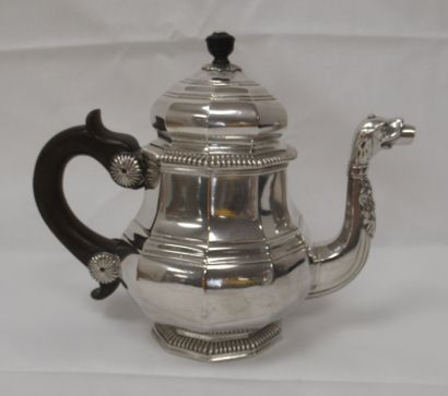 null Teapot in silver, spout in the shape of dog's mouth, grip in wooden handle....