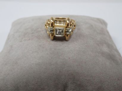 Yellow gold ring, centered with a brilliant...