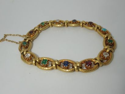 null Yellow gold bracelet set with brilliant-cut emerald, sapphire, garnet, turquoise,...