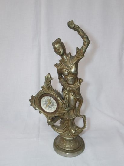 null Regula clock, decorated with a dancer. Height: 40 cm (wear to patina)