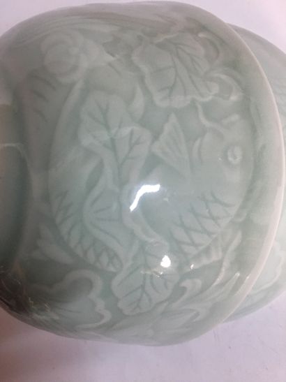 null CHINA Pair of celadon ceramic bowls with relief decoration of fish swimming...
