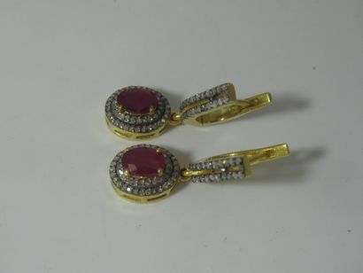 null Pair of vermeil earrings set with rubies and small diamonds. Gross weight: 6.15...