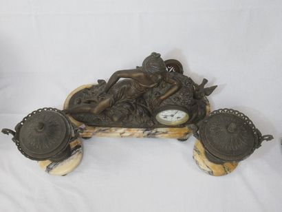 null Mantel set in patinated regule and mabre, including a clock decorated with a...