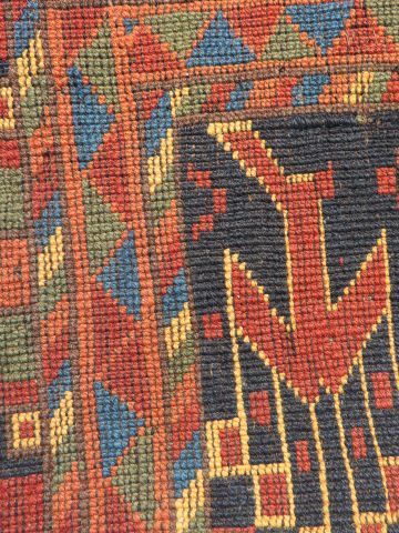 null Tapis Boukhara en laine à décor géométrique sur fond rouge. 200 x 300 cm