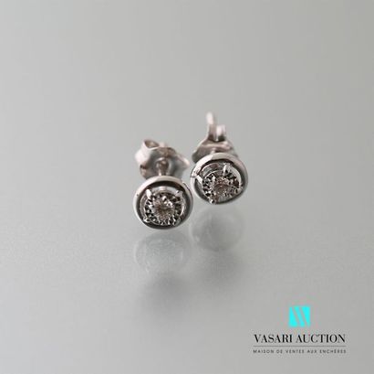 null Pair of white gold earrings adorned with two modern-cut diamonds. System for...