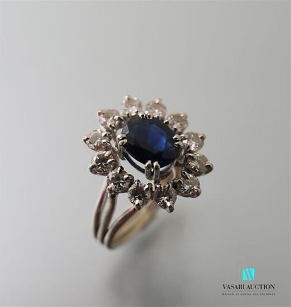null Ring in 750-thousandths white gold centred on an oval sapphire (1.10 to 1.30...