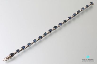 null 750-thousandths white gold line bracelet set with oval sapphires 
alternating...