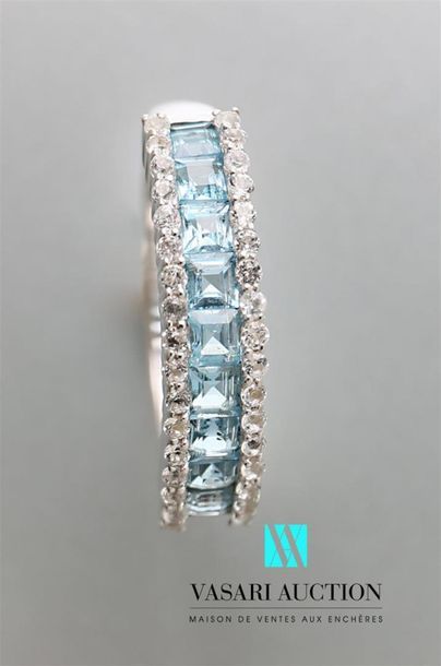 null 925-thousandths silver ring decorated with a line of blue topazes framed with...