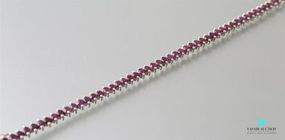 null Silver line bracelet set with round cut rubies, ratchet clasp with two safety
eightes...