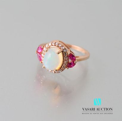 null Ring in vermeil decorated with a cabochon opal hemmed with white topazes, the...