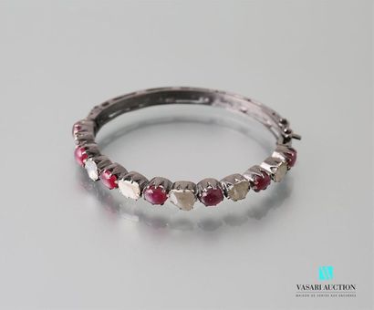 null Rigid bracelet in patinated silver set with rubies and rough diamonds, ratchet...