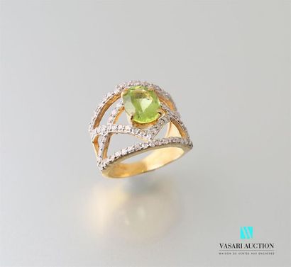 null Ring in vermeil centred on a peridot, the openwork frame formed by lines set...