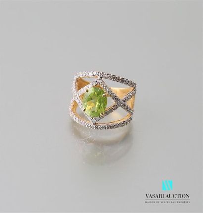 null Ring in vermeil centred on a peridot, the openwork frame formed by lines set...