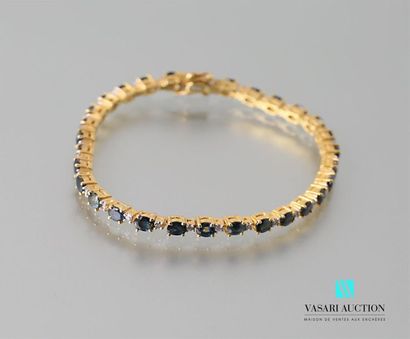 null Vermeil line bracelet set with sapphires calibrating a total of about eight...