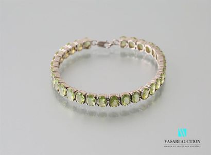 null Silver bracelet set with oval peridots, the clasp snap hook Gross
weight: 18.22...