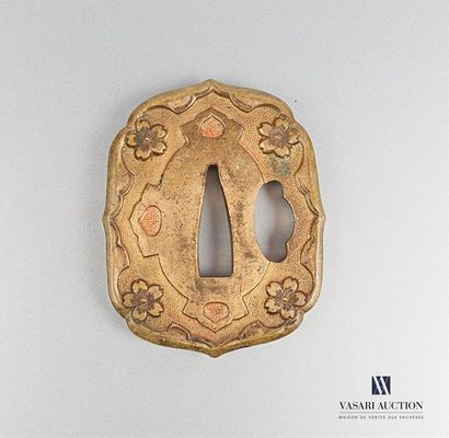 null Gilded bronze Tsuba, the rim scrolled, decorated with flowers on a granulated
background...