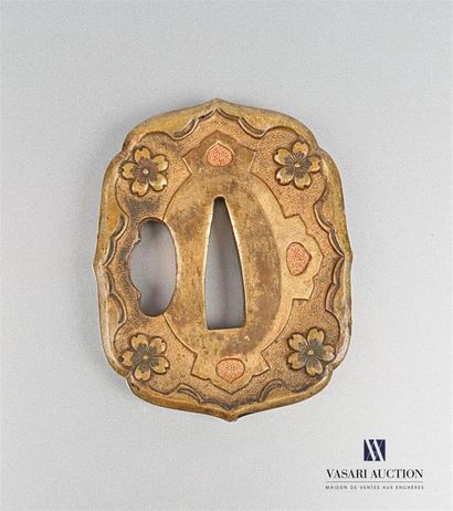null Gilded bronze Tsuba, the rim scrolled, decorated with flowers on a granulated
background...