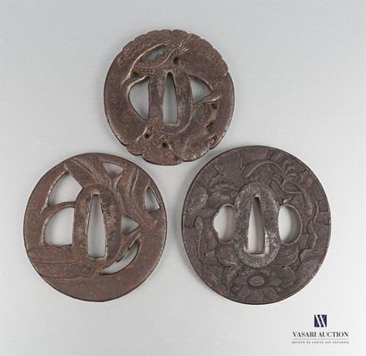 null Set of three iron tsubas, the first with openwork decoration of roots and foliage...