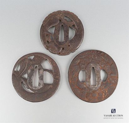 null Set of three iron tsubas, the first with openwork decoration of roots and foliage...
