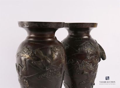 null JAPAN
Pair of bronze vases in baluster shape with rotating decoration in relief...
