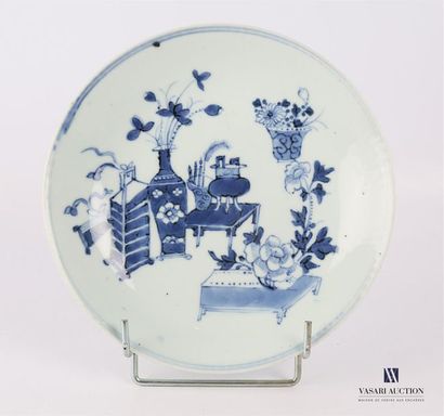 null CHINA 
Rim plate in blue white porcelain decorated with household objects and...