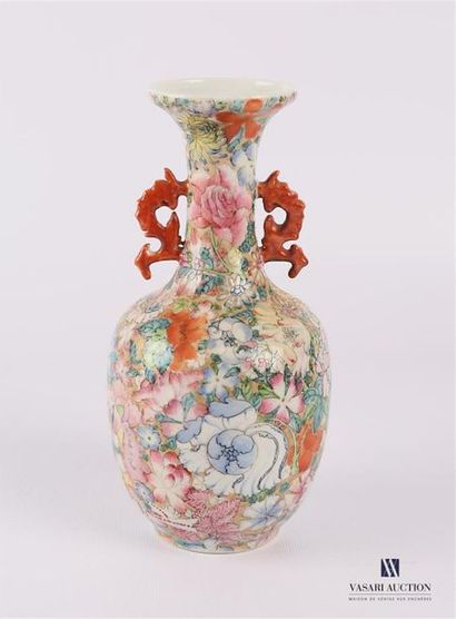 null CHINA Baluster-shaped
vase, the neck tightened in white porcelain treated in...