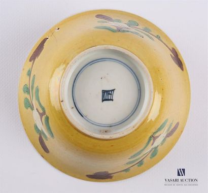 null Porcelain bowl with yellow background decorated with flowered branches on the...