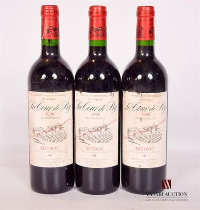 null 3 bottlesChâteau LA TOUR DE BYMédoc CB1998Stained
 and worn (some tears). N:...