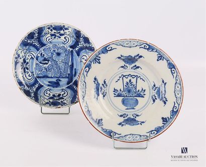 null DELFT
Two earthenware plates with a blue and white decoration, one decorated...