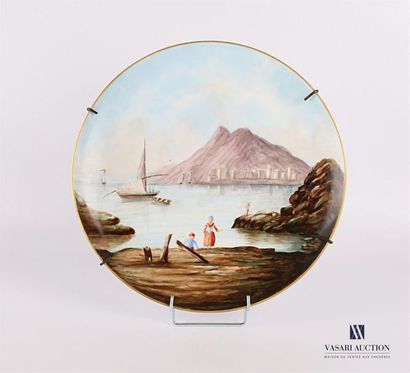 null Porcelain dish decorated with a fishing scene, signed in the Caune basin, the...