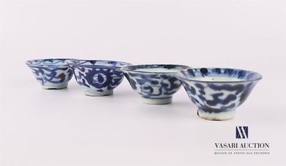 null CHINA 
Suite of four porcelain cups with blue white decoration of stylized flowers...