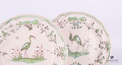 null MOUSTIER 
Two white earthenware plates, the crenellated rim, decorated in green...