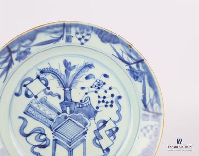 null CHINA 
Porcelain soup plate with blue white decoration of a leafy pot, a stool...